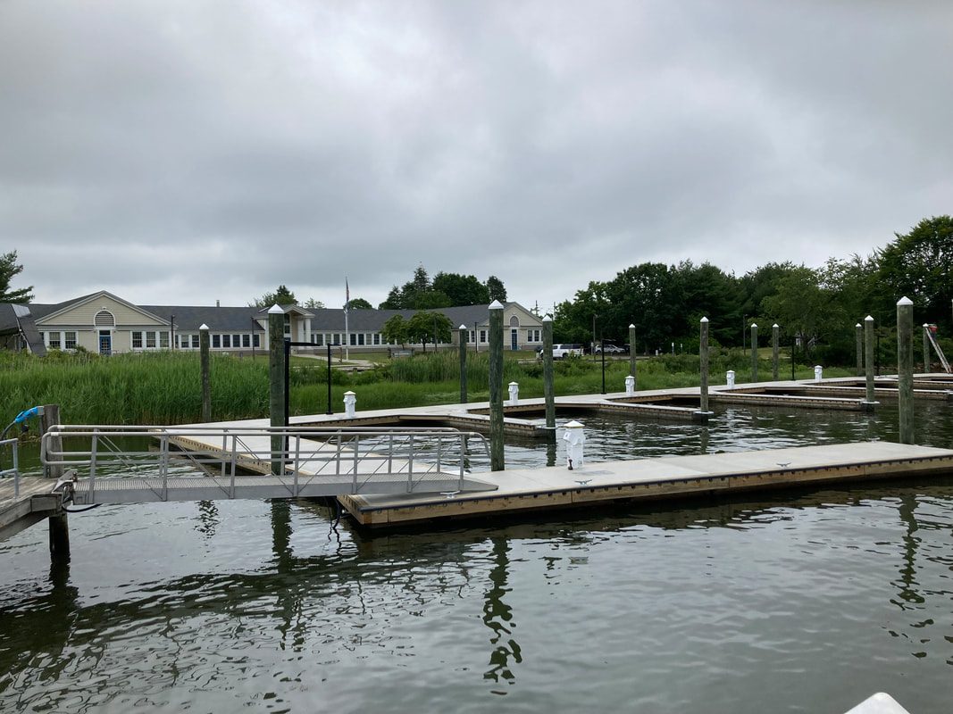 Completed floating dock system in front of the DEEP Marine Headquarters building