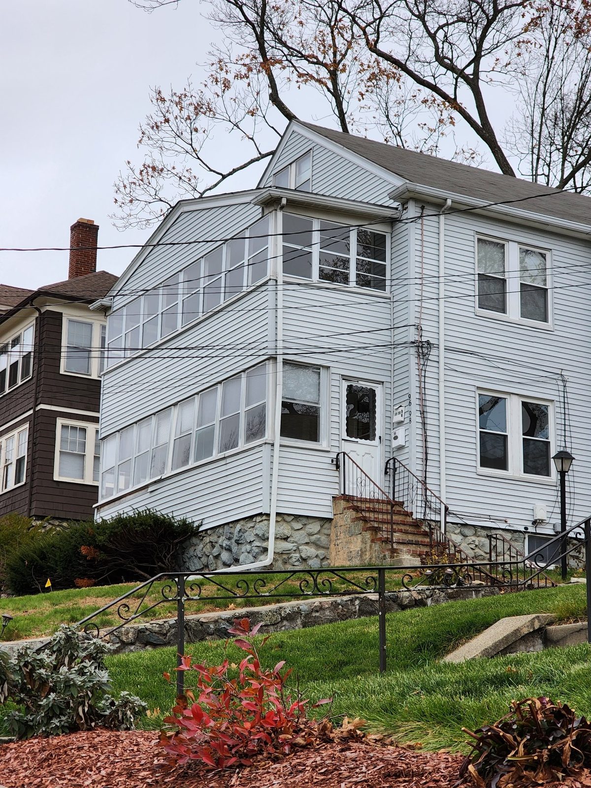 The house before work began, with its original two-story enclosed front porch addition