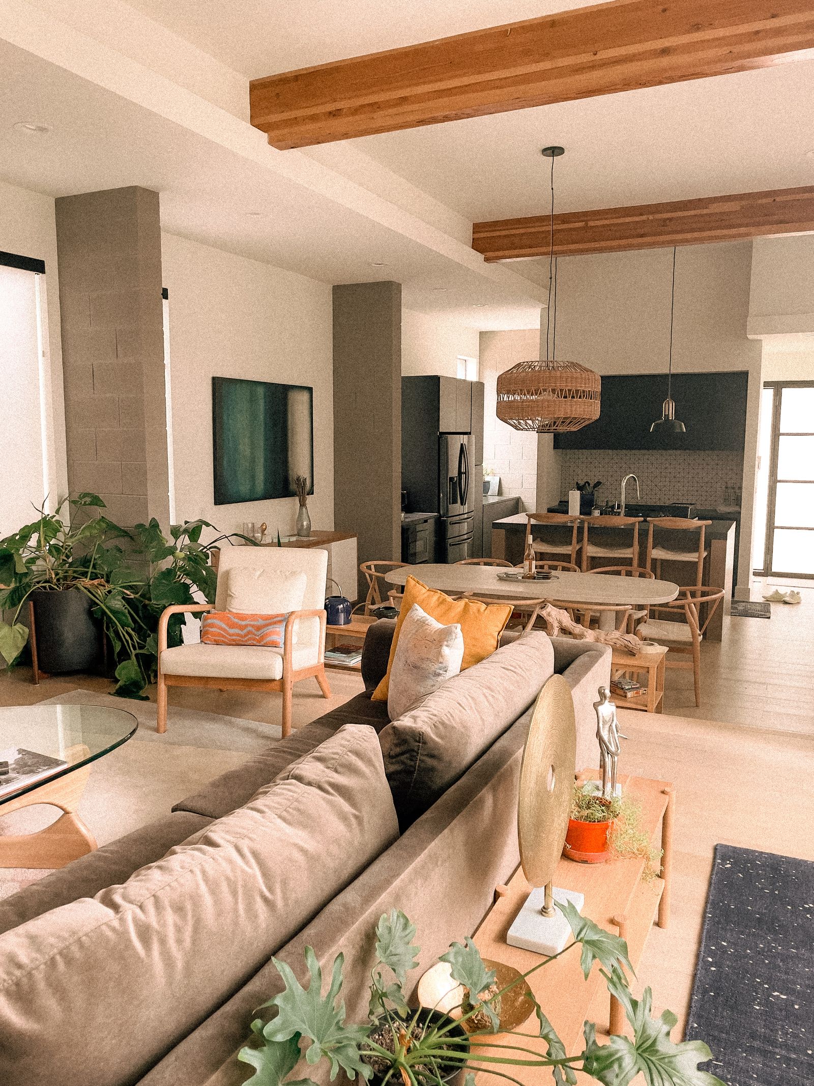 Open-plan living and dining with wood accents